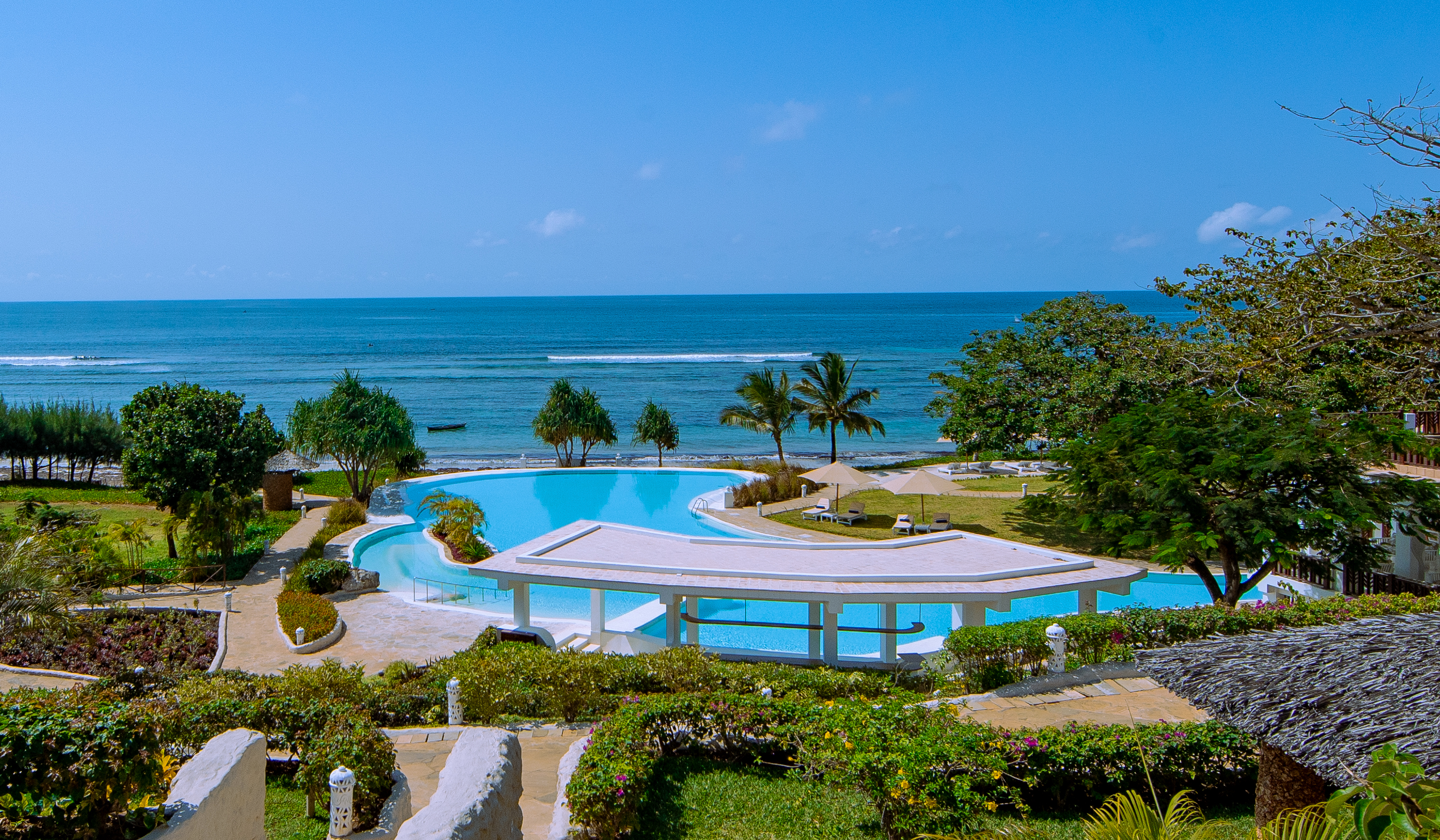 Infinity pool and beachfront at Zahari Oceanfront in Msambweni