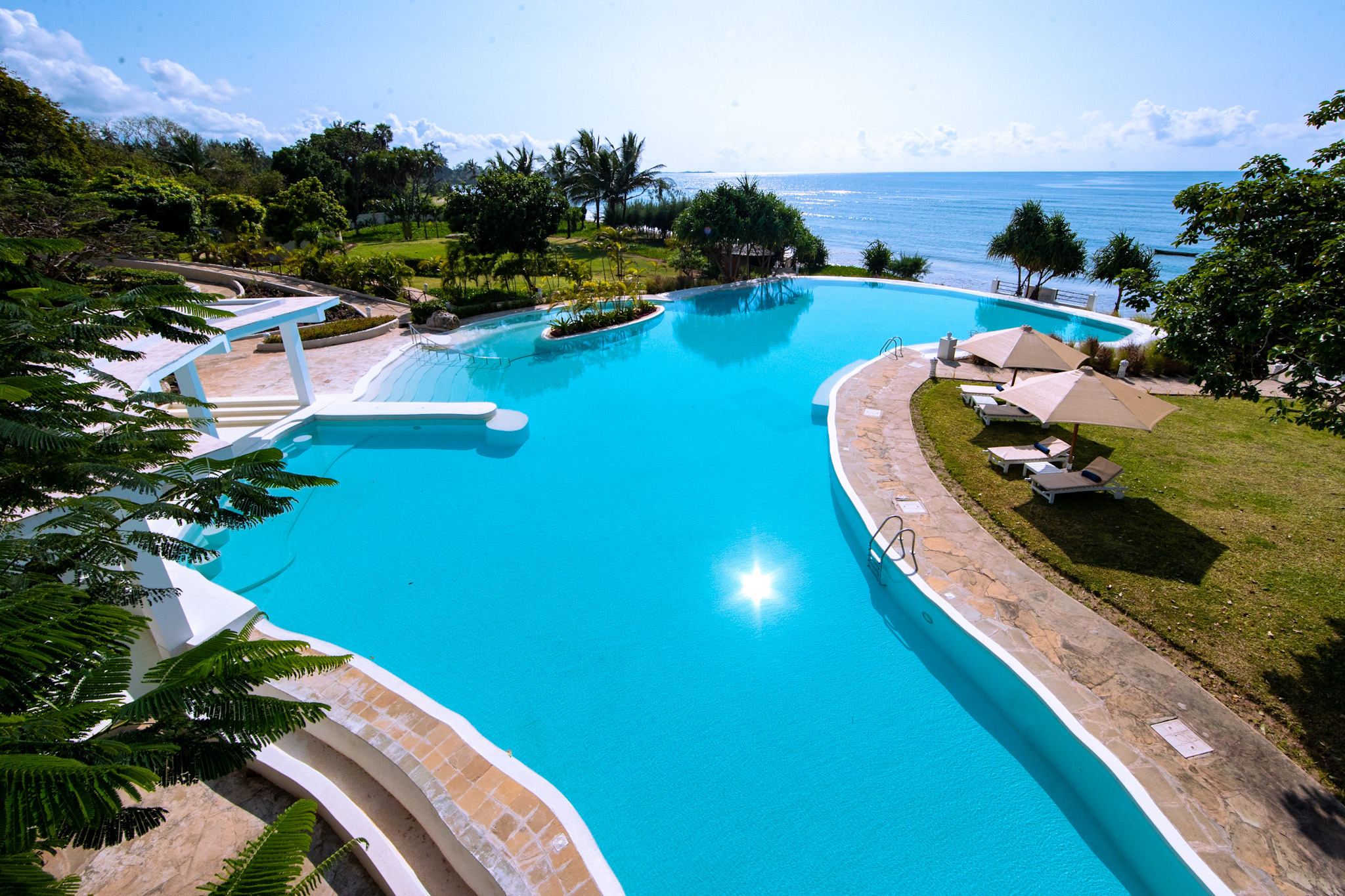 Infinity pool and beachfront at Zahari Oceanfront in Msambweni