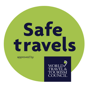 A "Safe travels" seal approved by the World Travel & Tourism Council.