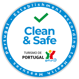 Round "Clean & Safe" sticker by Turismo de Portugal with checkmark.