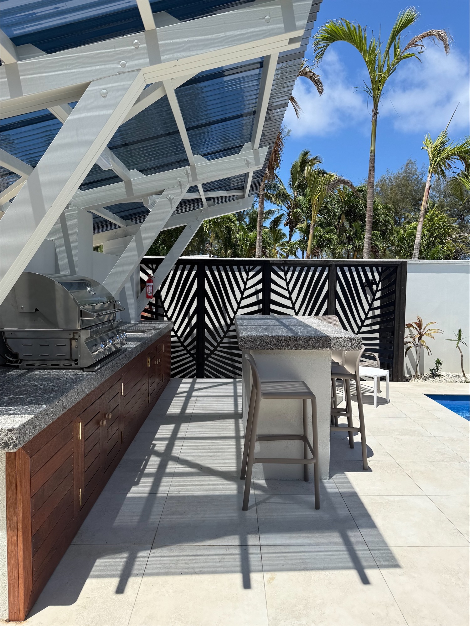 BBQ Hut & island bench by the pool