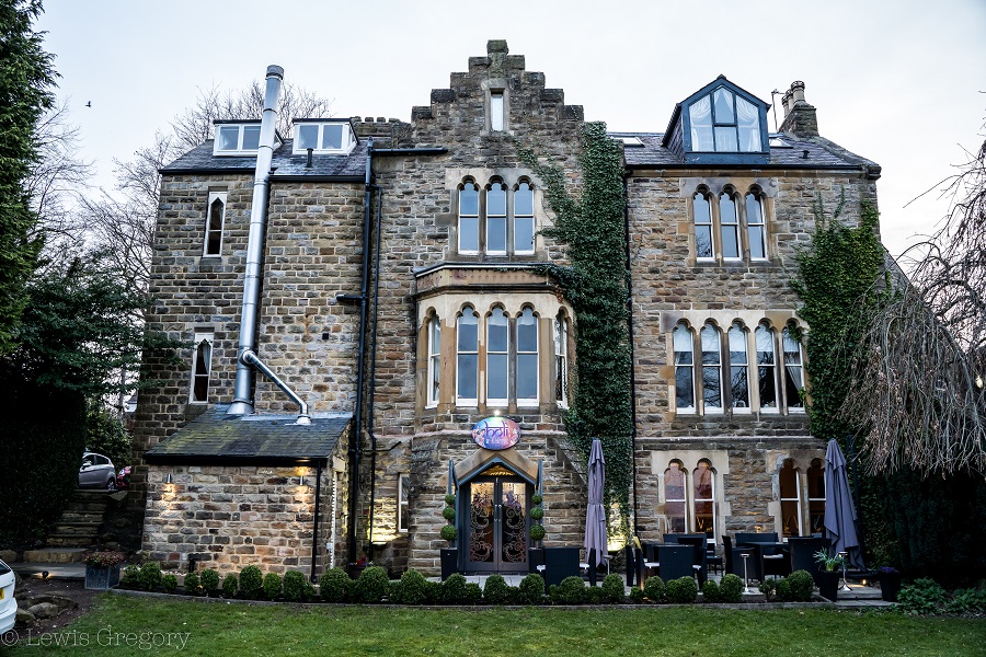 Main building for Farnley Tower, restaurant entrance with patio , garden and views