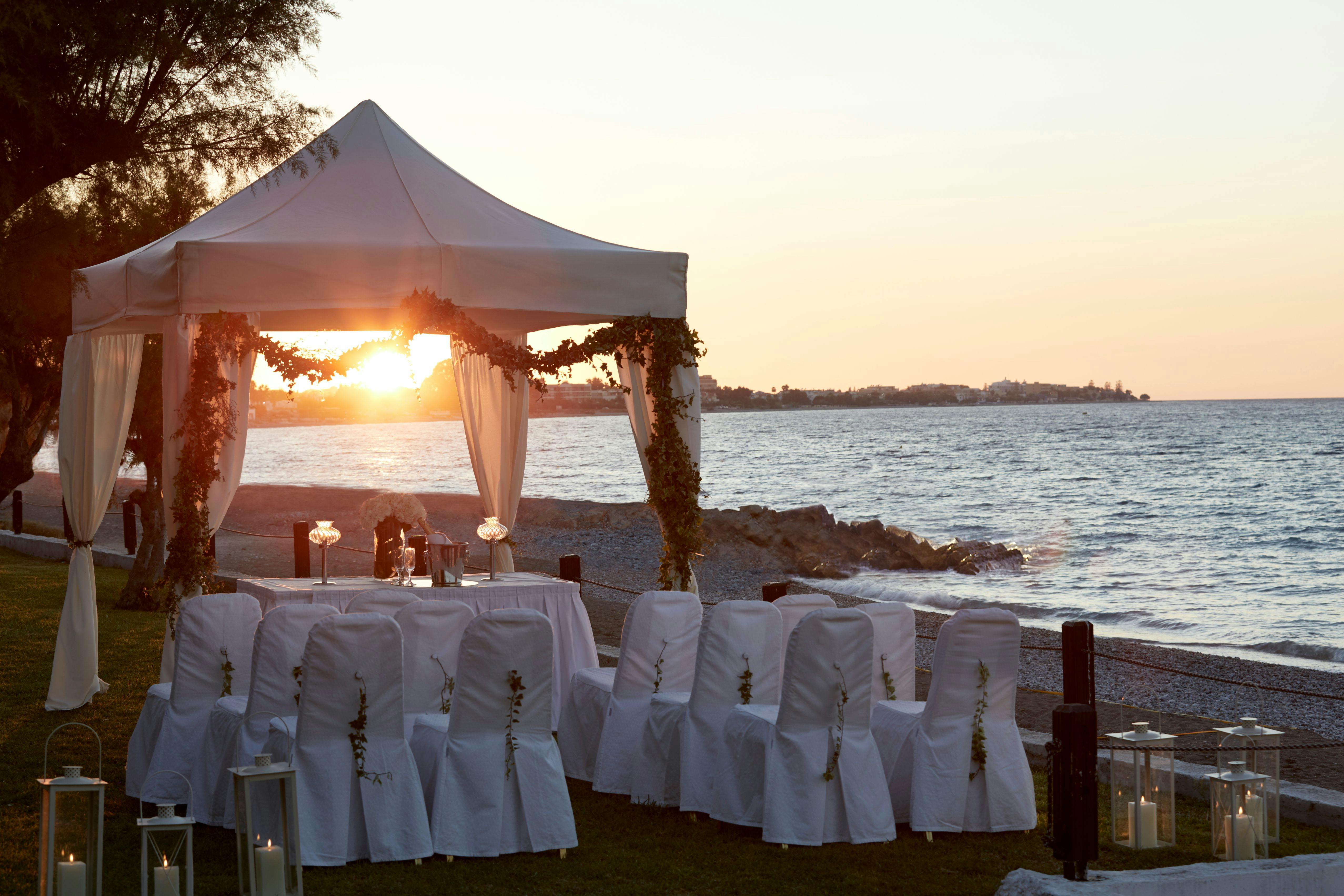 Beachfront wedding with sunset in Rhodes