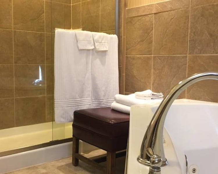 Private walk-in shower and tub in Yosemite Suite