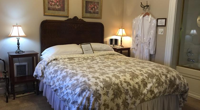Tiger-oak headboard of queen bed in Tuolumne Room