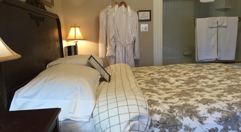 Luxurious Robes and queen bed in Tuolumne Room