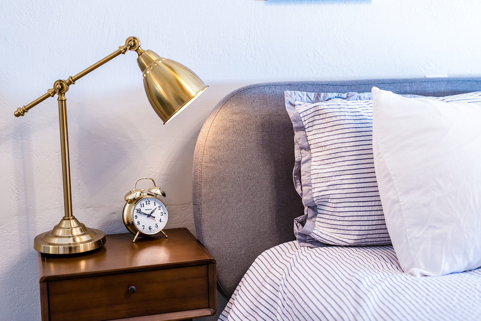 Luxury hotel room bed and nightstand Beulah Michigan