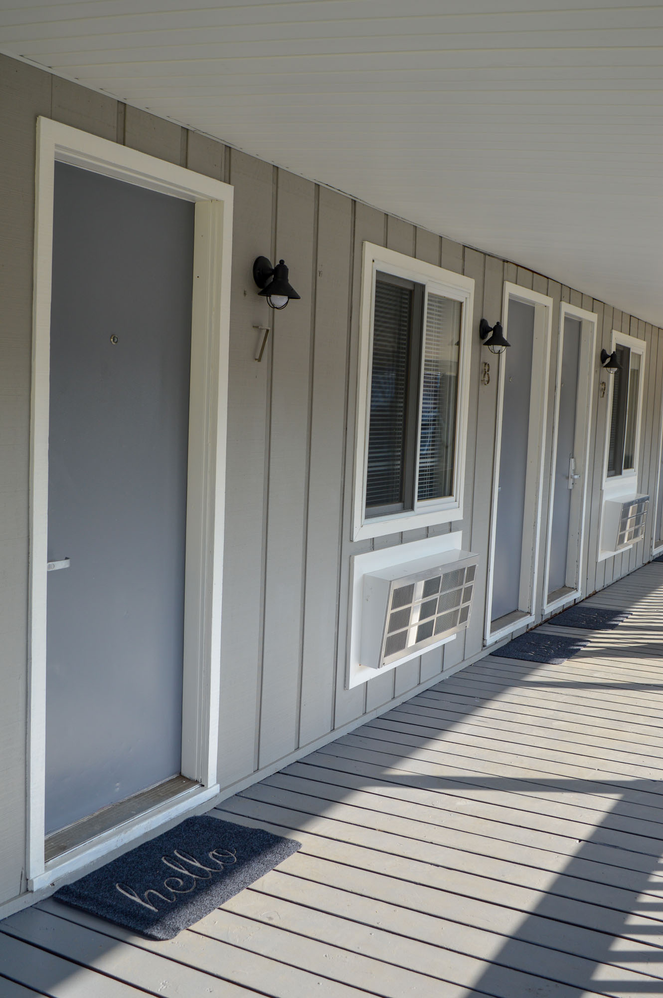 Walkway with room entrances at Coastal Suites Resort MI