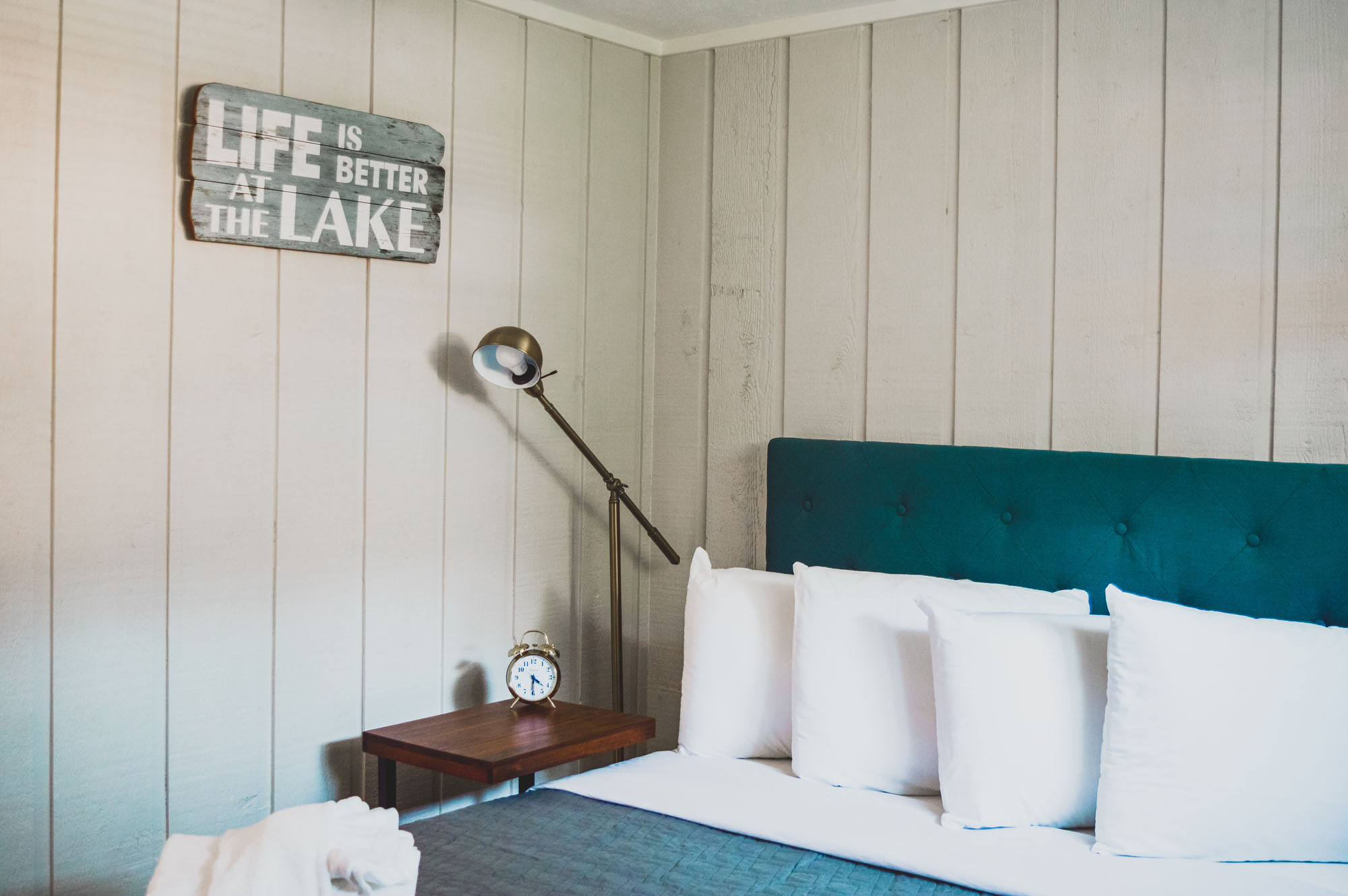 Luxury hotel room bed and nightstand Beulah Michigan