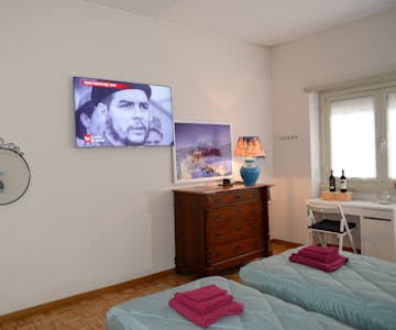Deluxe White Room with Samsung Television 55 inches