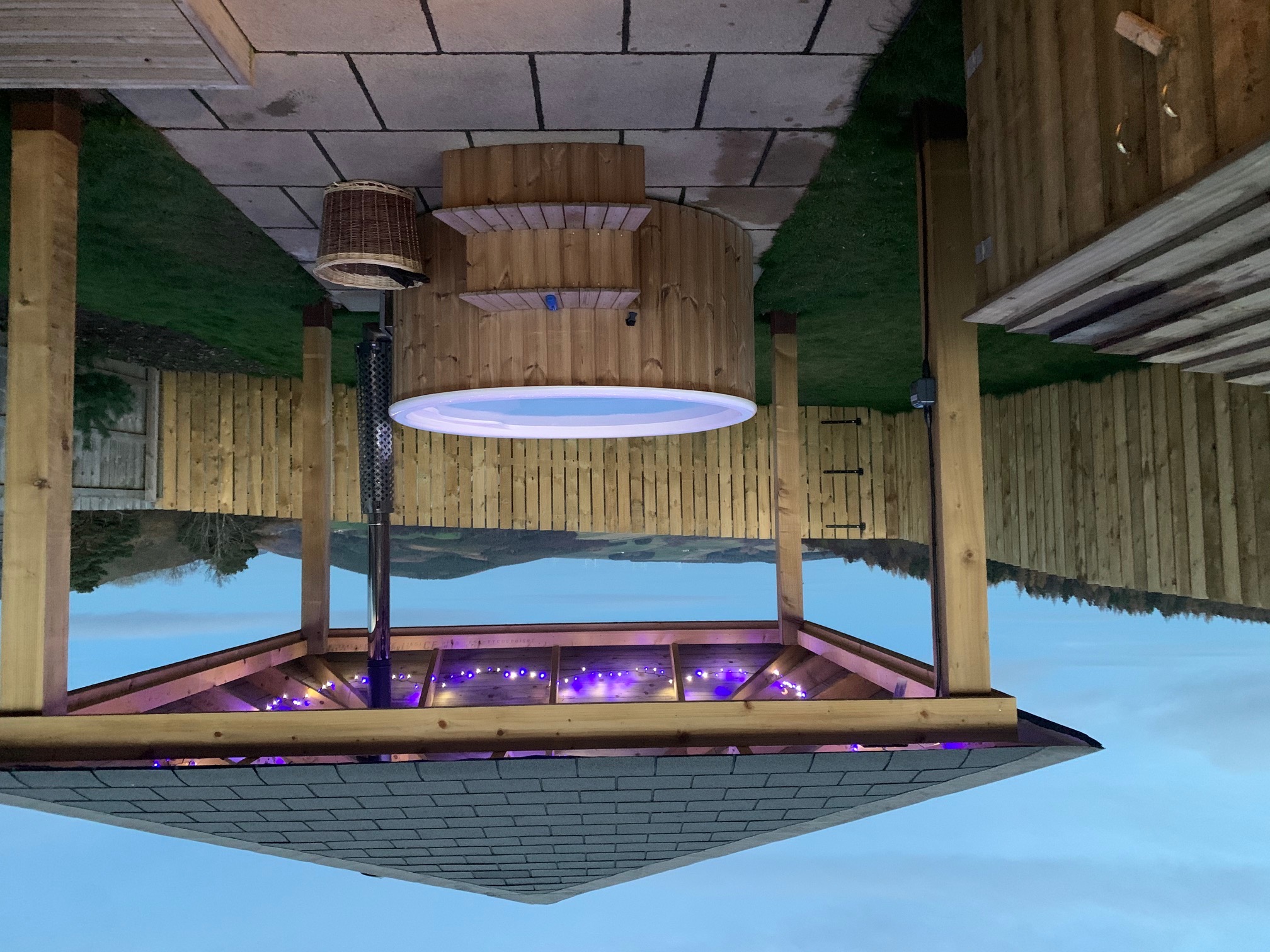 Fairy lights night time wood fired hot tub