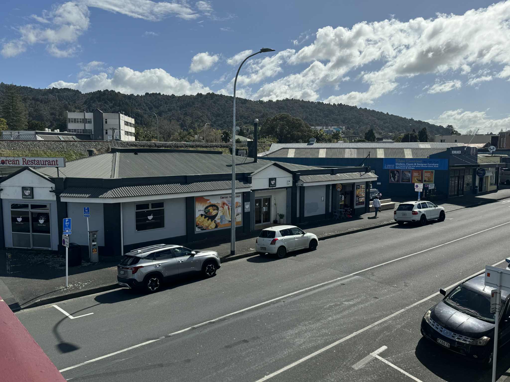 Balcony view of restaurants across the road