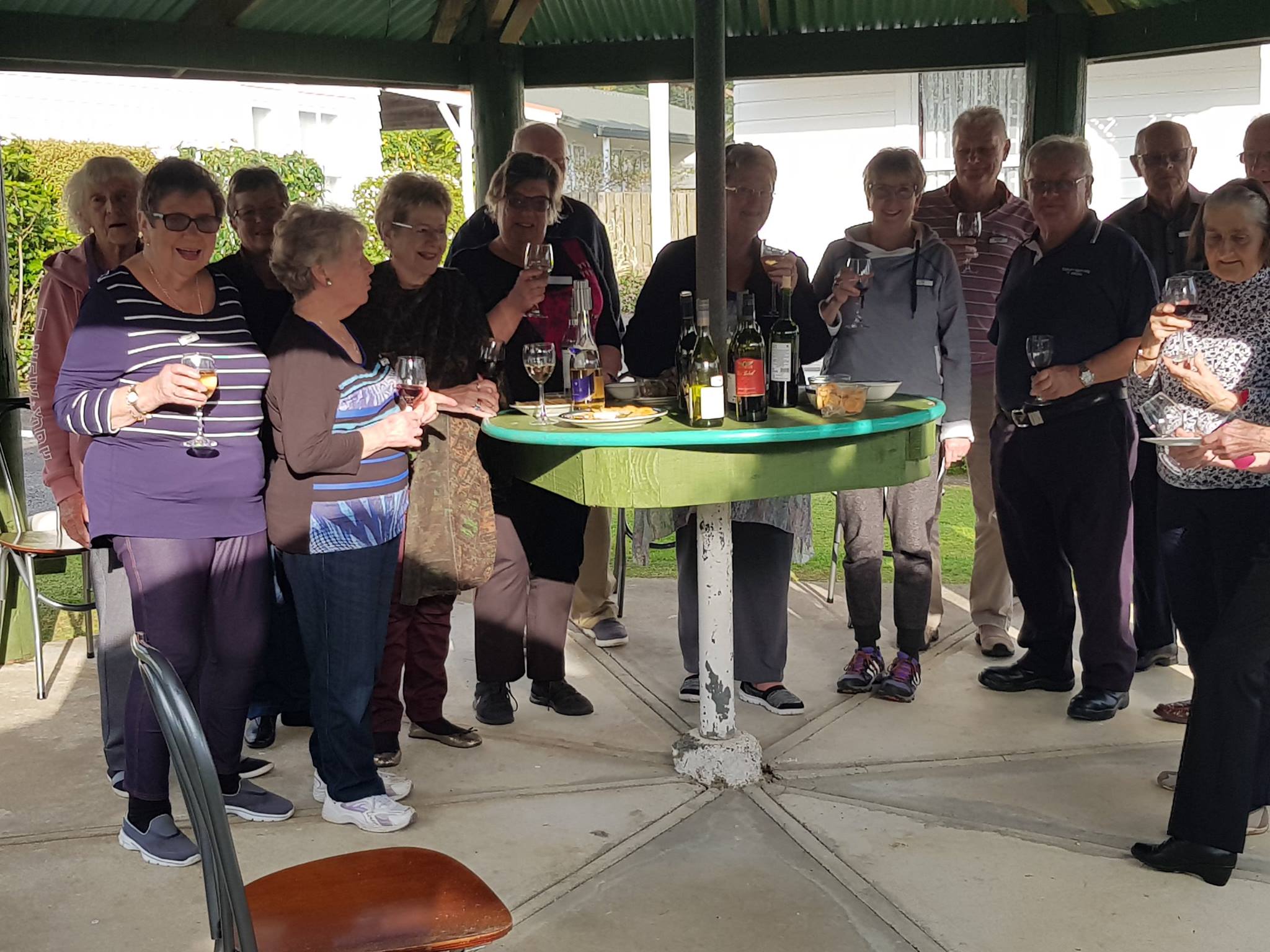 Guests enjoying a wine in a pergola