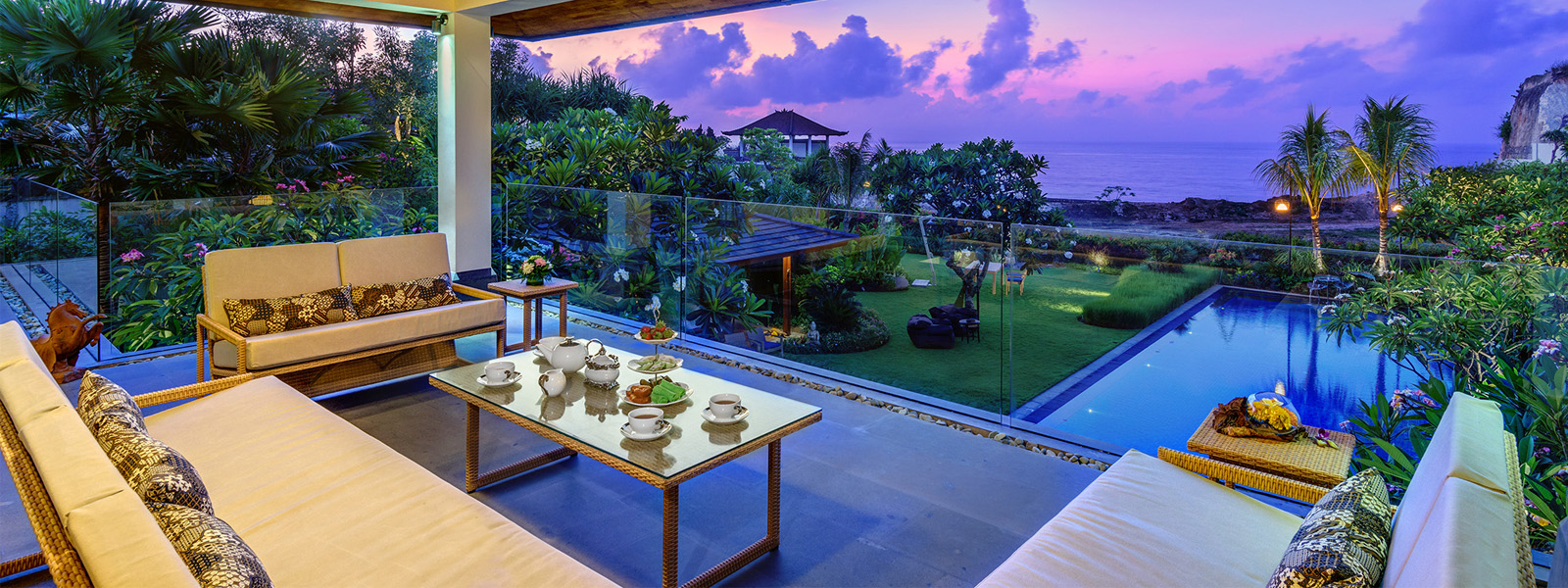 PRIVATE VILLAS OF BALI - Villa Frangipani - Afternoon tea at Villa Frangipani upper level. Ocean and swimming pool view.