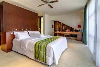 PRIVATE VILLAS OF BALI - Villa Tirta Kencana - Vista Suite bedroom with office area an en-suite bathroom.