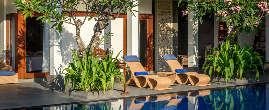 PRIVATE VILLAS OF BALI - Villa Frangipani - comfortable deck chairs by the swimming pool to relax and soak up the sun.