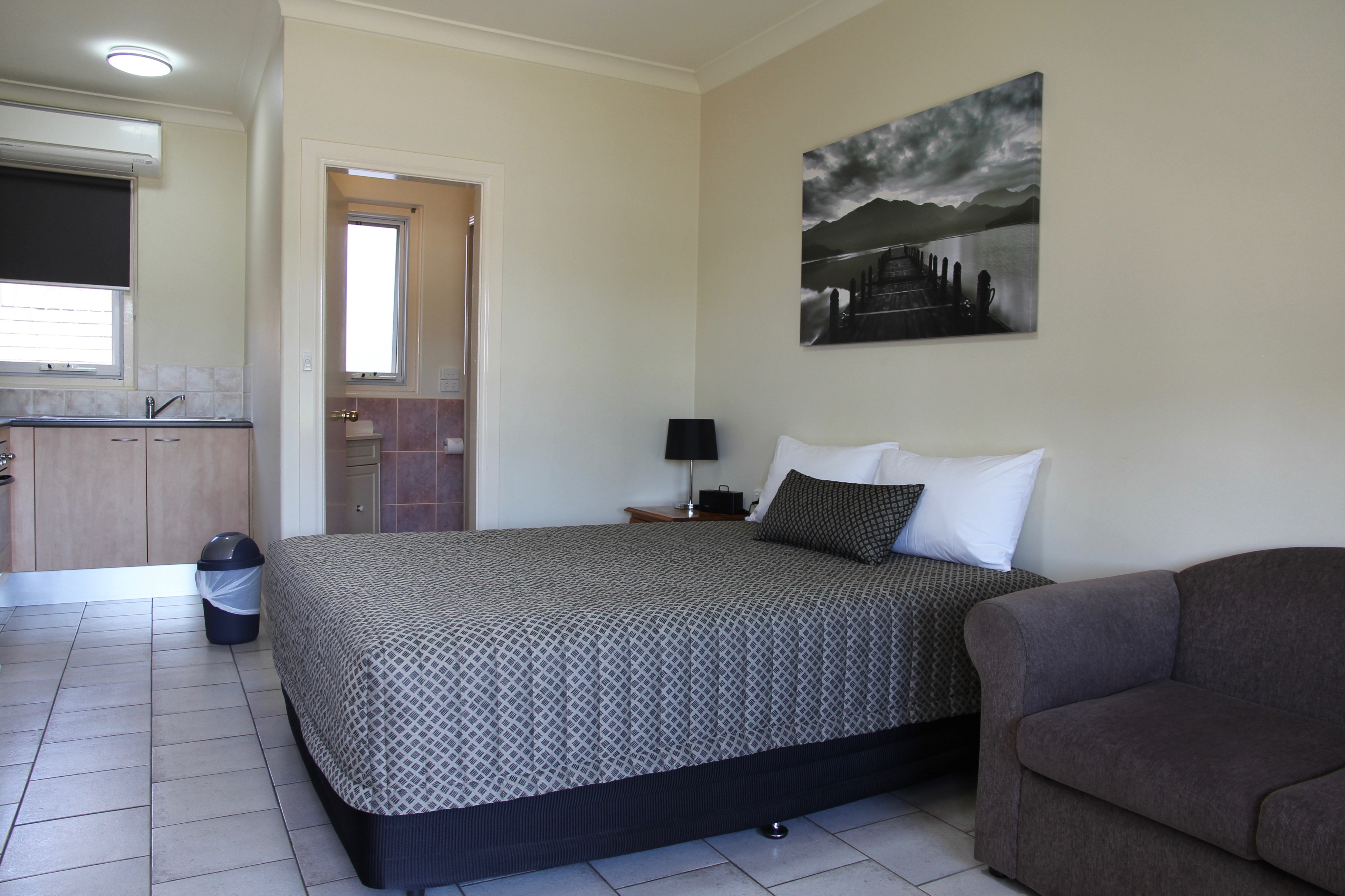 Comfortable queen-size bed in Tumut room