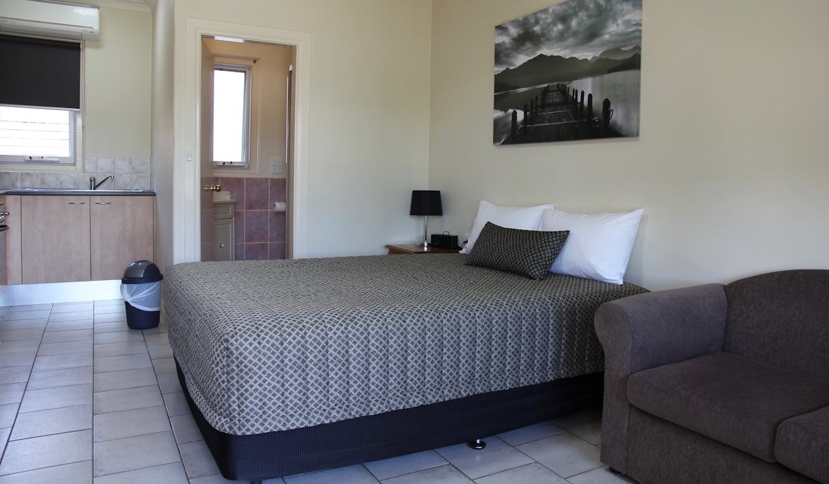 Comfortable queen-size bed in Tumut room