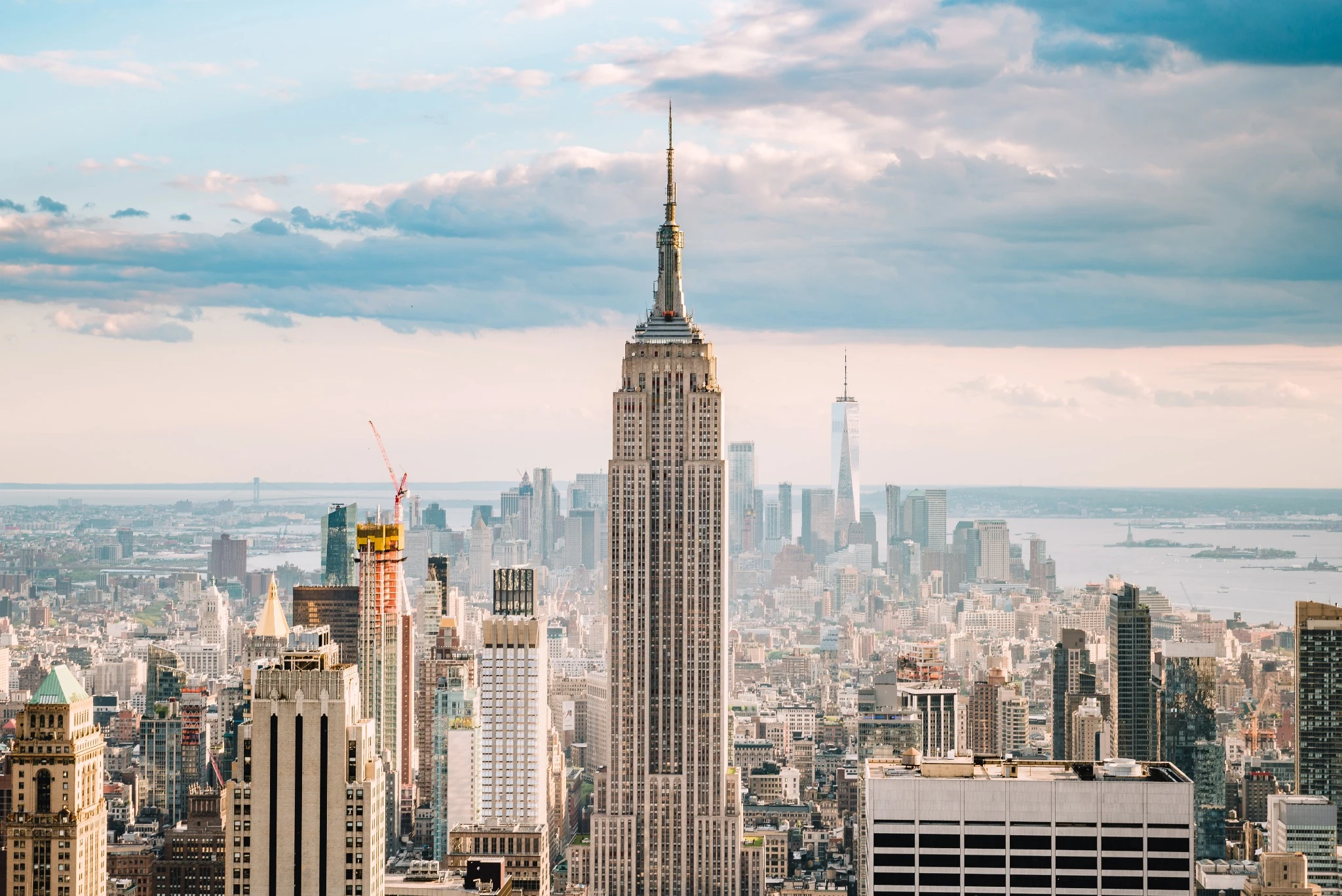 Empire state building with a bright blue sky backdrop