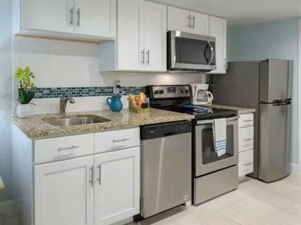 Grand Seas Resort - Daytona Beach, FL, beach resort w/ spacious accommodations, living area, kitchen, & oceanfront views.