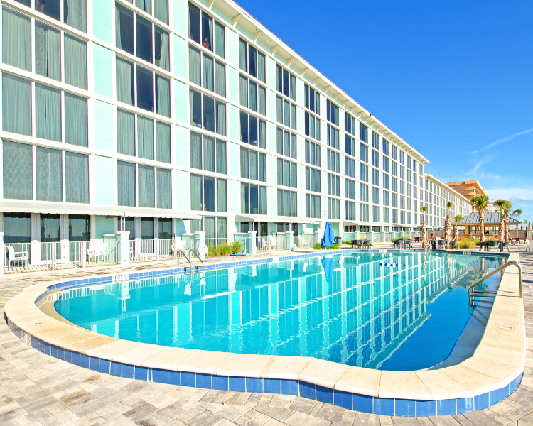 Grand Seas Resort - Daytona Beach, FL, beach resort w/ beach access, pools, poolside bar, & onsite dining.