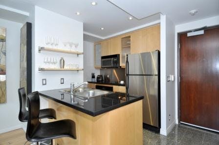 Yonge Suites The Loft, Split Level One Bedroom Suite Kitchen with Stainless Steel Appliances