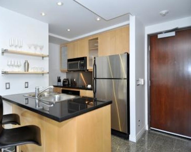 Yonge Suites The Loft, Split Level One Bedroom Suite Kitchen with Stainless Steel Appliances