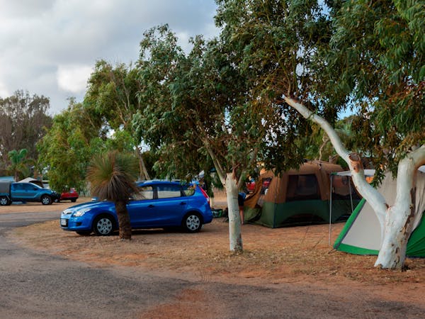 "Powered-caravan-and-camping-sites-with-cars-tents-and-caravan"