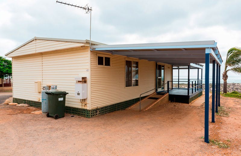 "Back and side view of two bedroom beach cottage 47 with carport"