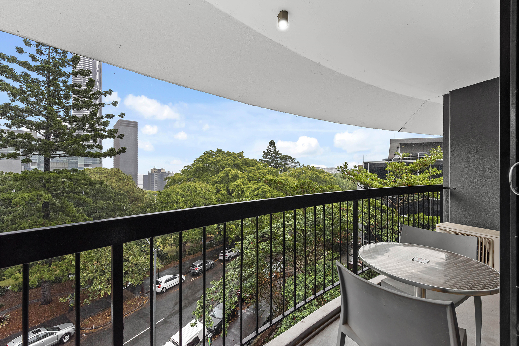 View of city skyline and gardens from the balcony at the Tower Mill Hotel Brisbane