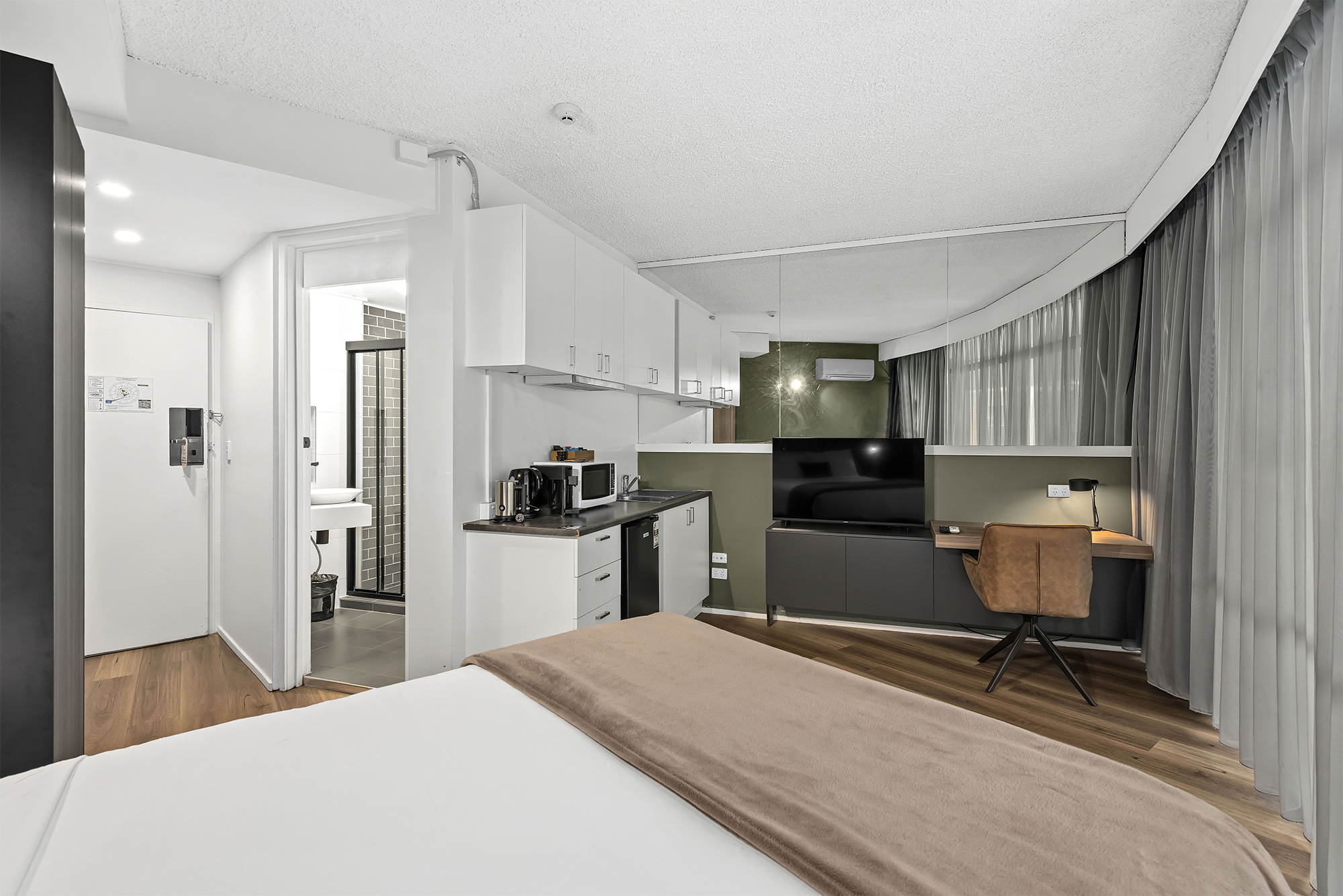 Tower Mill Hotel Brisbane queen room with kitchenette and work desk