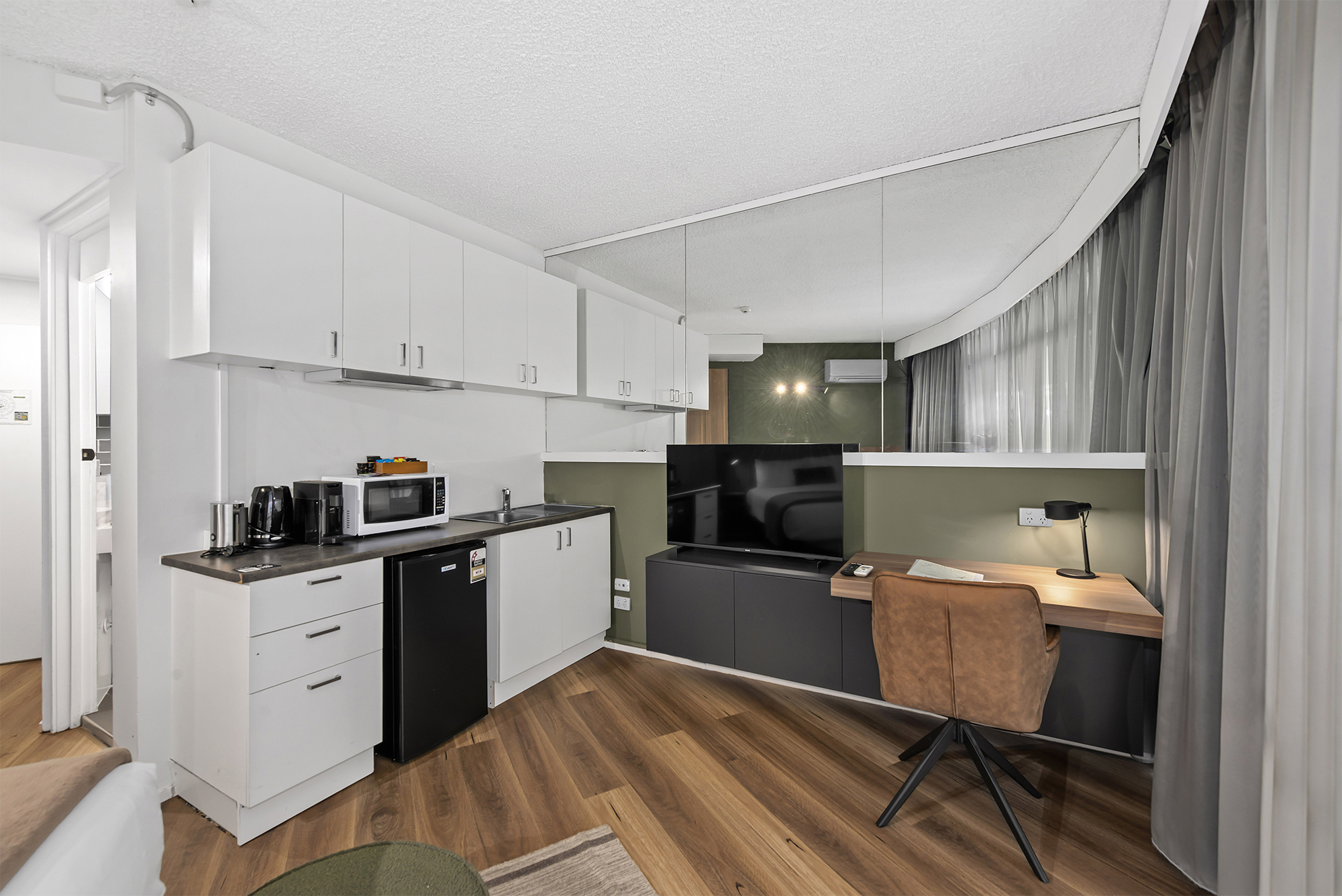 Kitchenette facilities and work desk in a Queen room at the Tower Mill Hotel