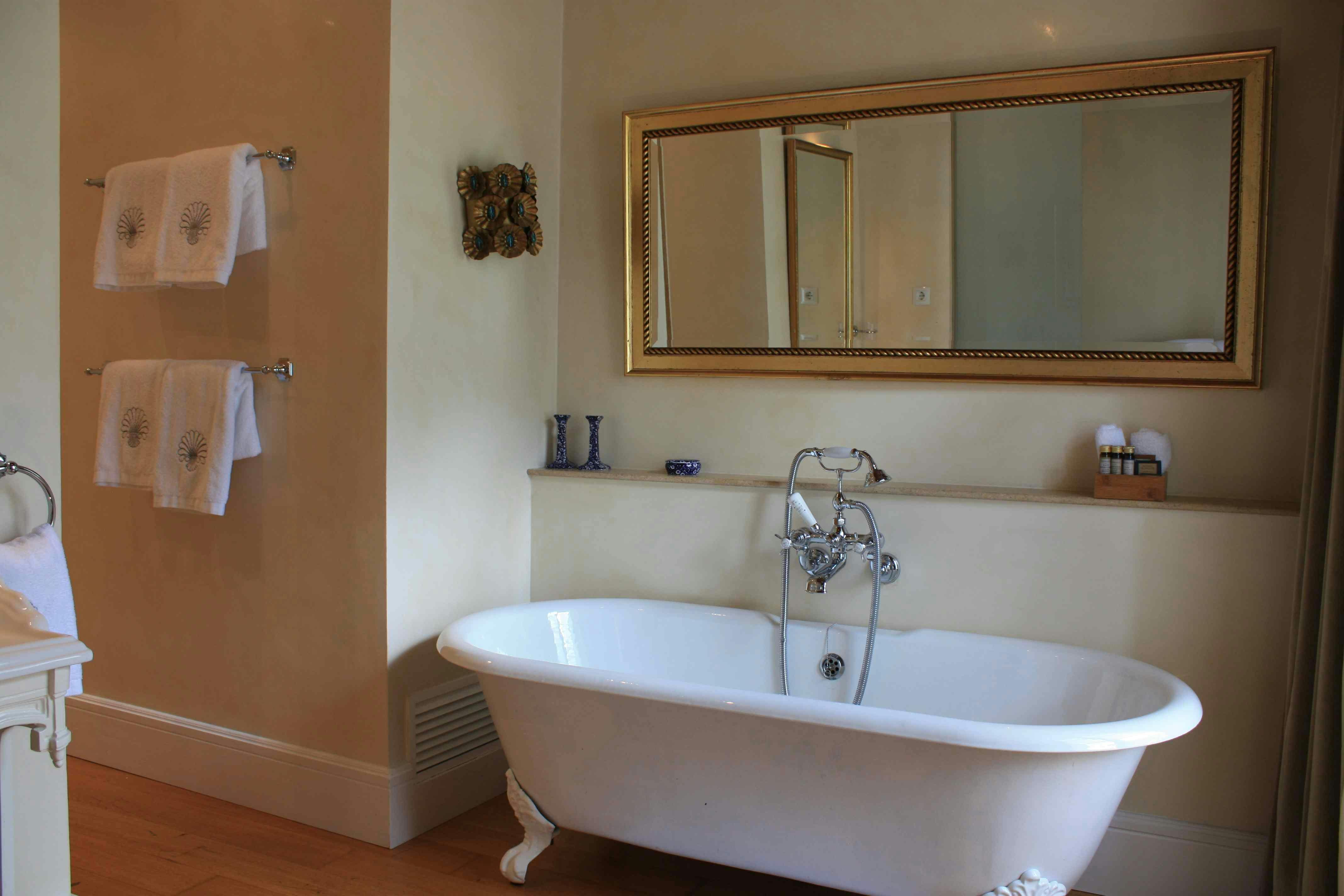 The free standing roll top bath within the Deia Junior Suite