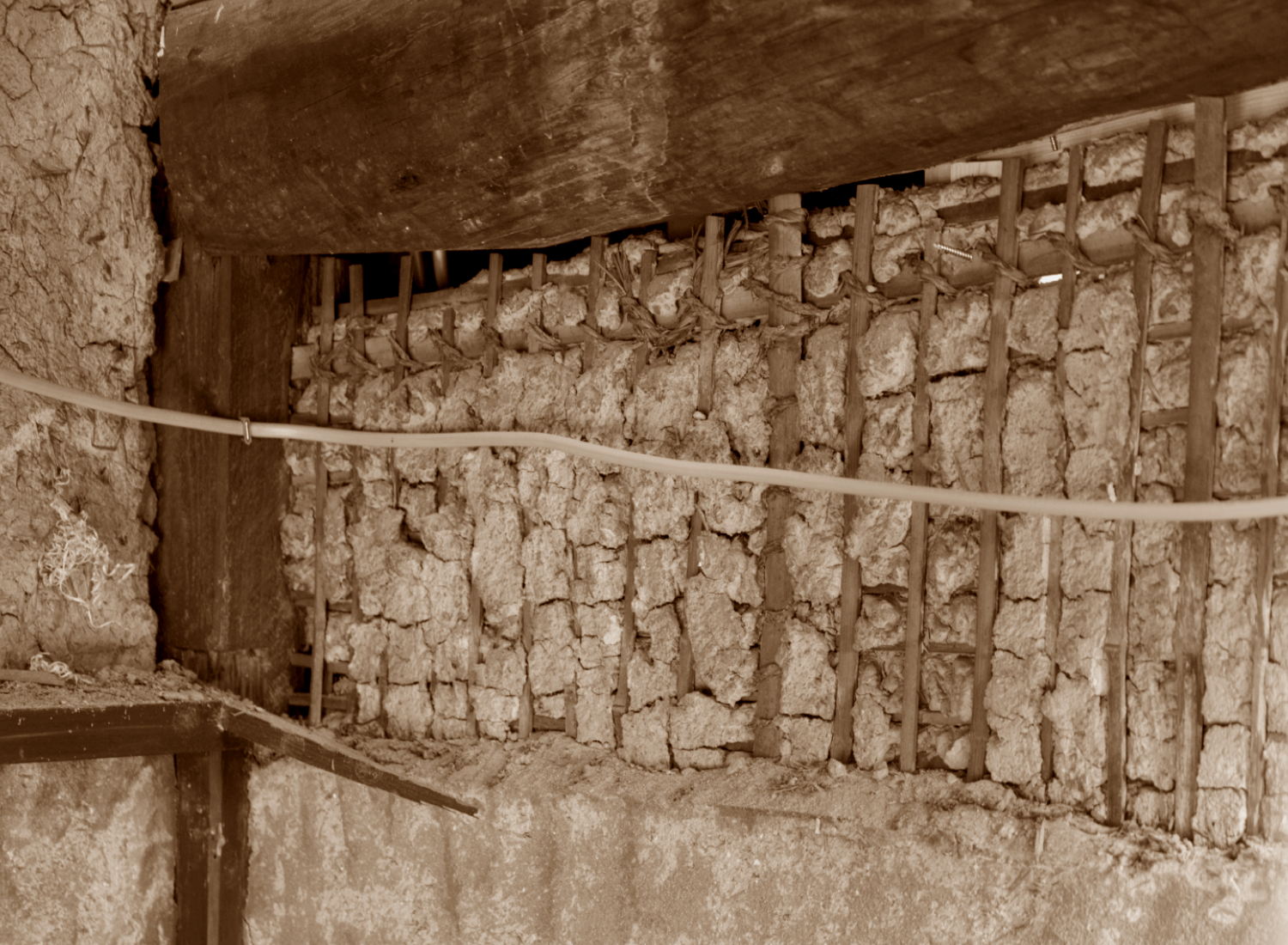 Kyoto BenTen Residences Restoration - Stripping walls down to original straw filling