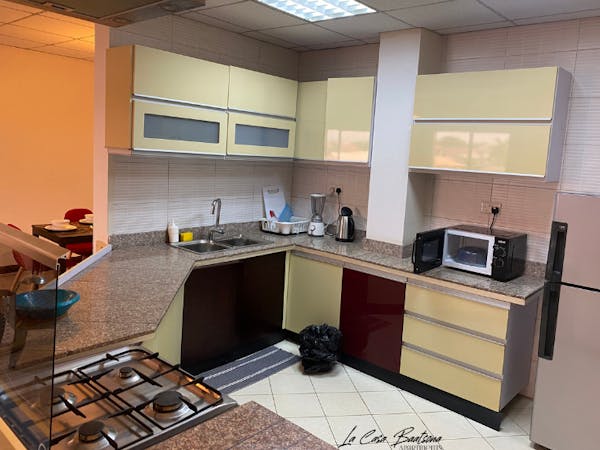 Fully equipped kitchen with appliances and granite countertops.
