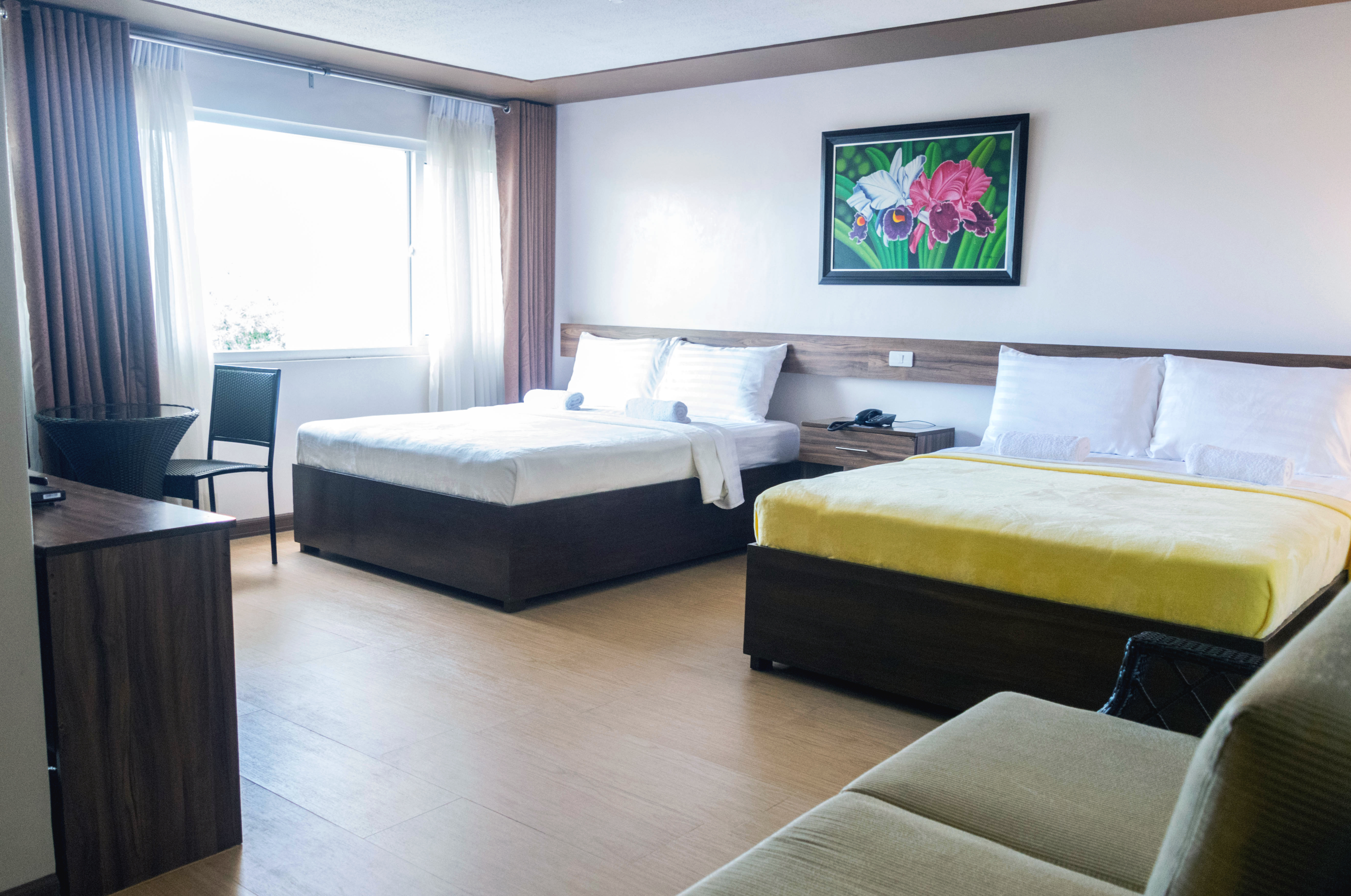 Family Suite with two queen beds and a sofa.