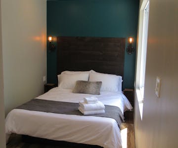 St. Jacobs Suite - has a rich wood headboard.