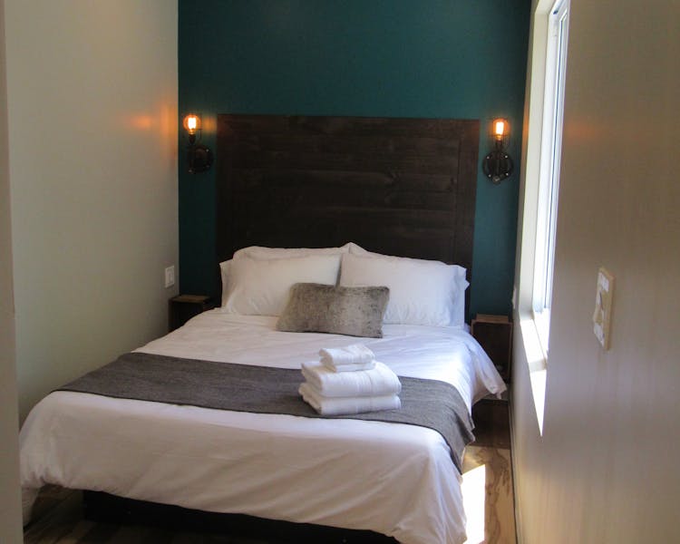 St. Jacobs Suite - has a rich wood headboard.