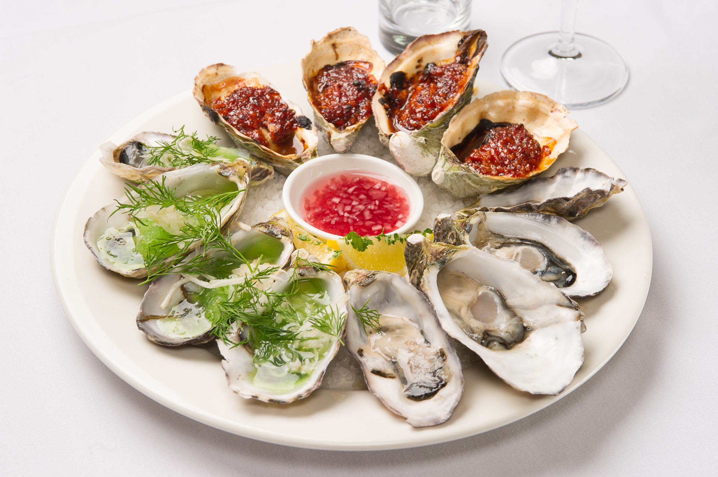 Raw, grilled, and dressed oysters. A perfect sampler platter!