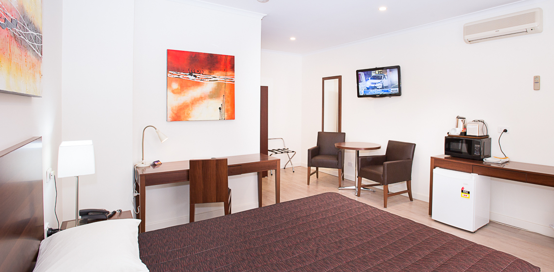 Experience a restful stay in our modern room equipped with everything you need for work and relaxation.
