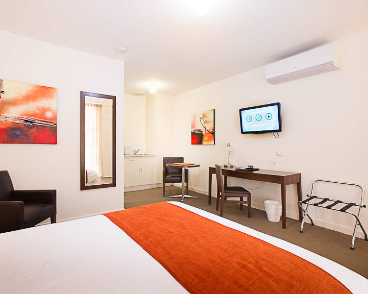 Simple motel stay: Room, kitchen, bath.