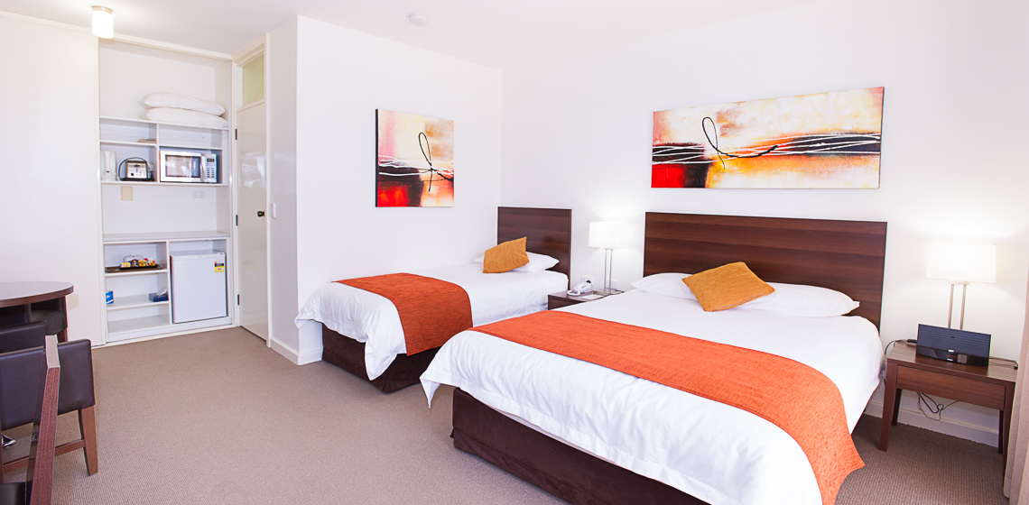 Single & double bed motel room.