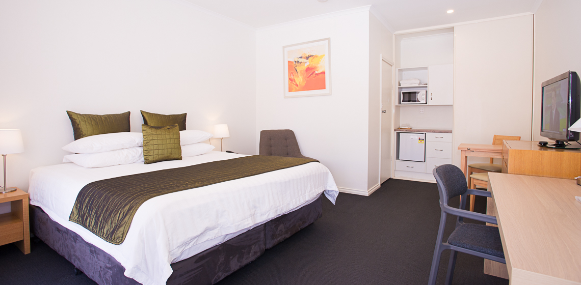 Standpipe Golf Motor Inn Relaxing motel room, perfect for a getaway.