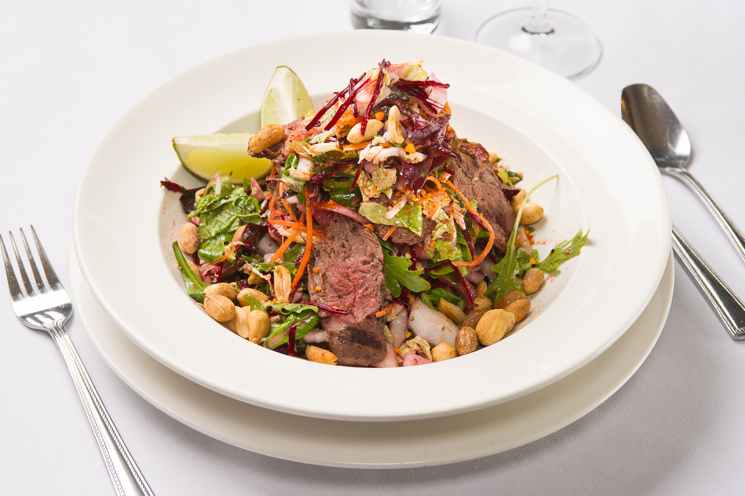 Enjoy tender roast beef, crunchy nuts, and fresh veggies in this delicious salad.