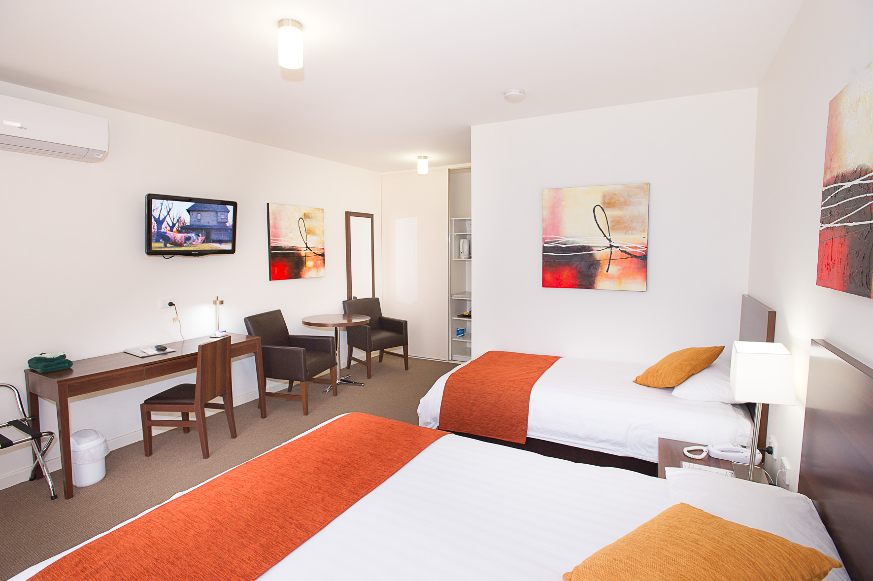 Standard Room: 1 double & 1 single bed, microwave, TV, & more.