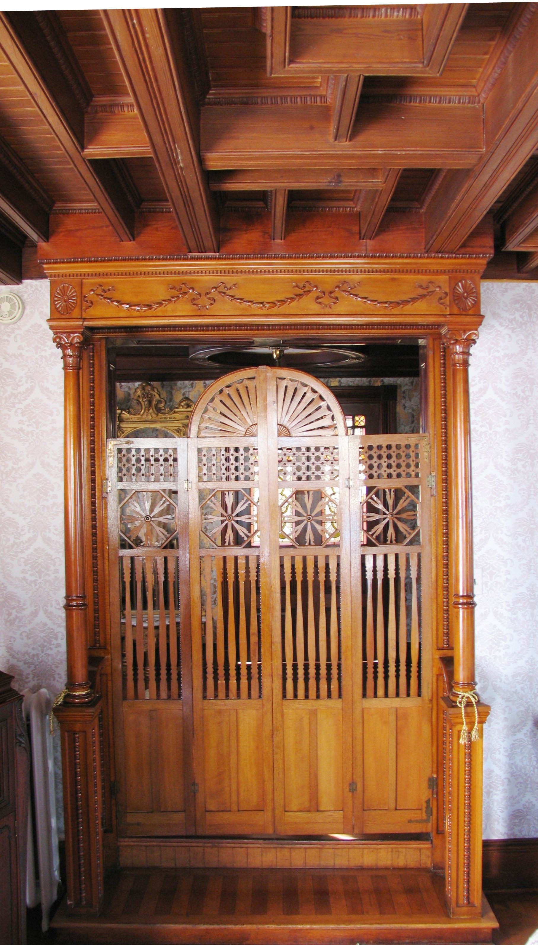 Wood partition in the doorway leading into the Music Room.