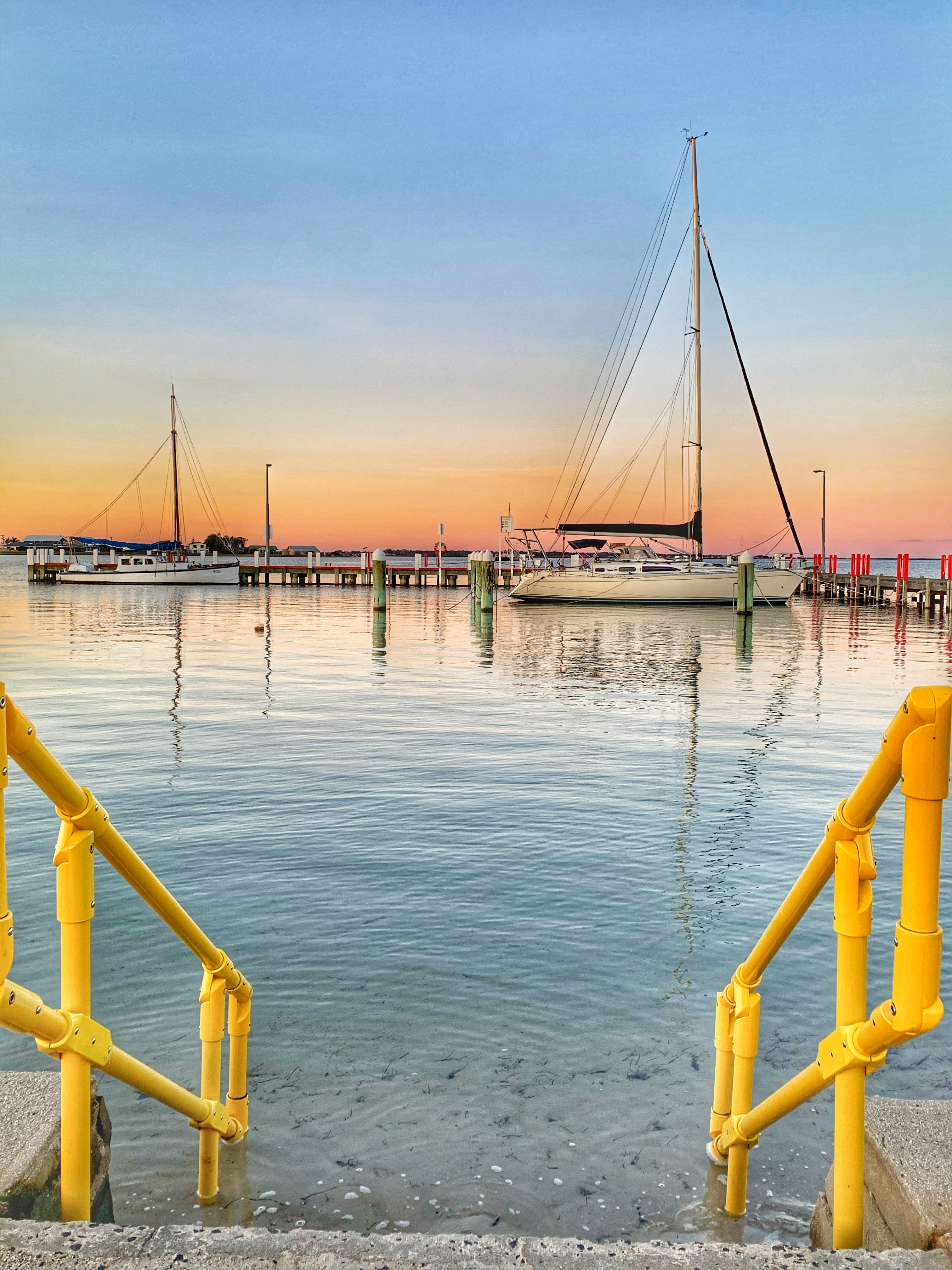 Steps to the "beach" near Castim By The Jetty Kiosk & Boat Hire
