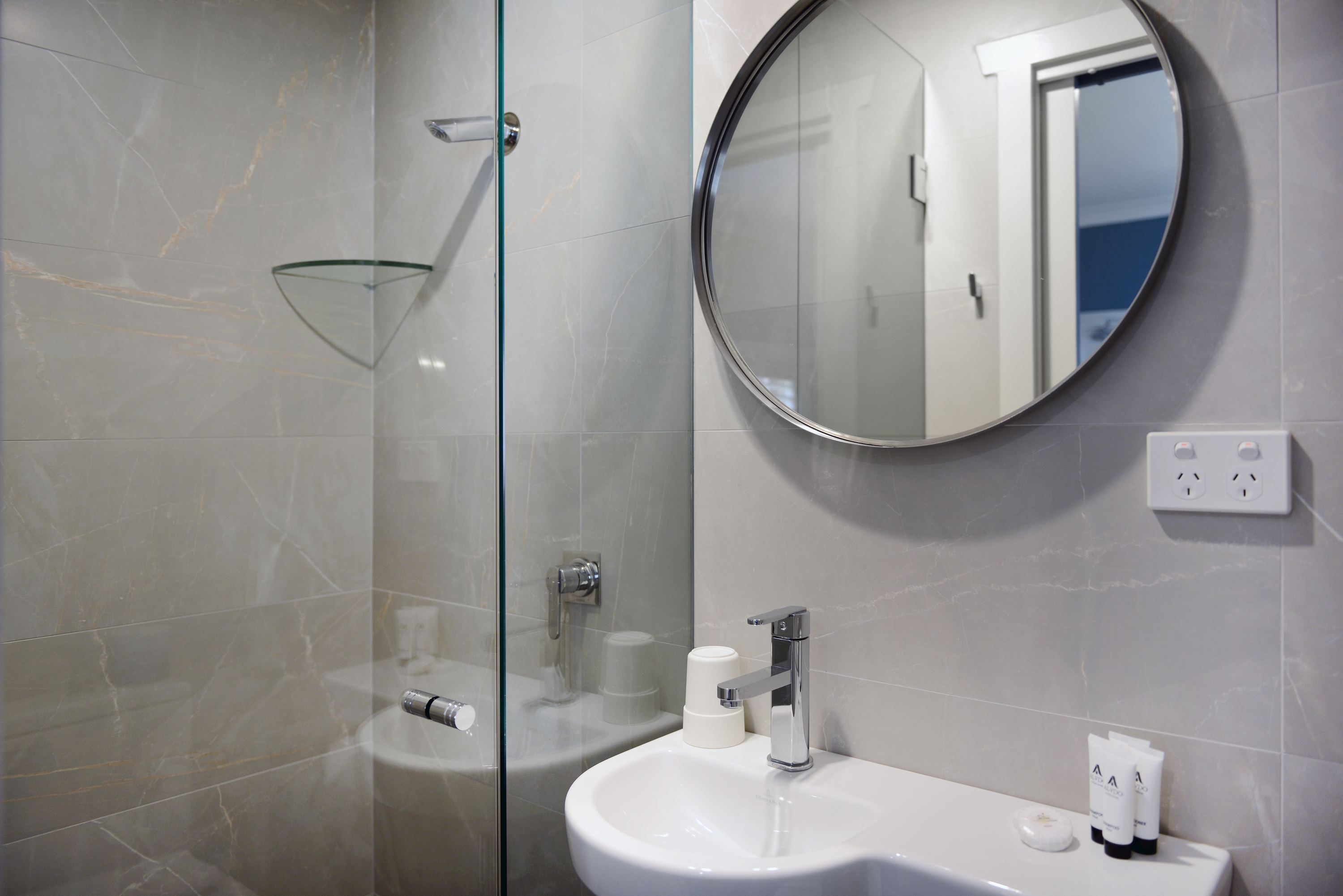 Shower and sink in private ensuite bathroom