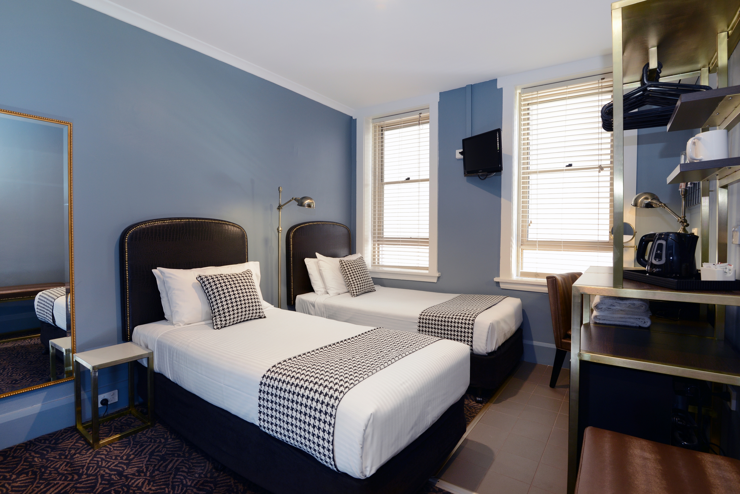 Twin room with vintage decor at The Maisonette