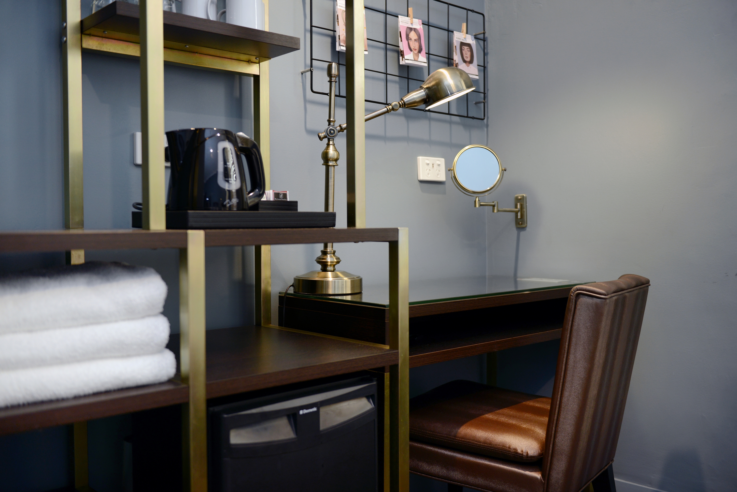 Tea and coffee station with desk and mirror